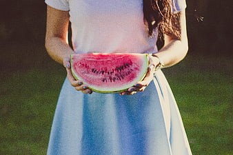 Woman Holding Sliced Watermelon in Summer Dress