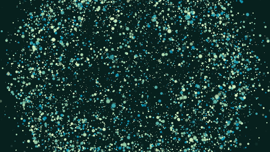 Abstract blue and white bokeh particles on dark background