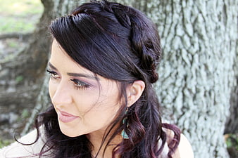 Portrait of Woman with Braided Hair and Purple Makeup