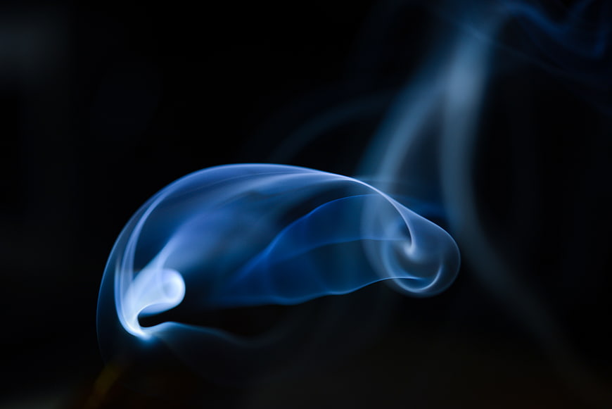 Abstract Blue Smoke Swirl on Black Background