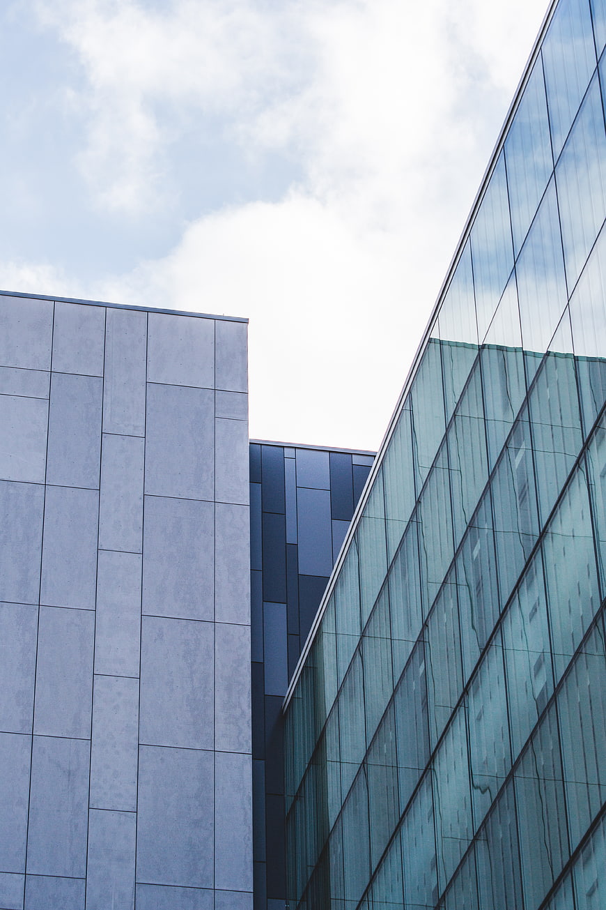 Modern Glass and Concrete Architecture with Blue Sky
