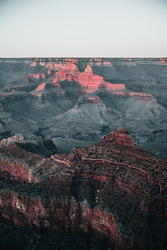 Dramatic Grand Canyon Landscape with Red Rock Formations at Dusk