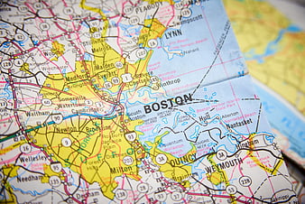 Close-up of a folded paper map showing Boston and surrounding areas