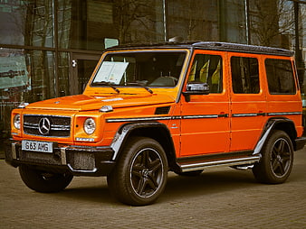 Orange Mercedes-Benz G63 AMG SUV parked outside dealership