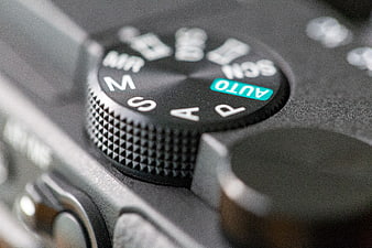 Close-up of camera mode dial with auto setting selected