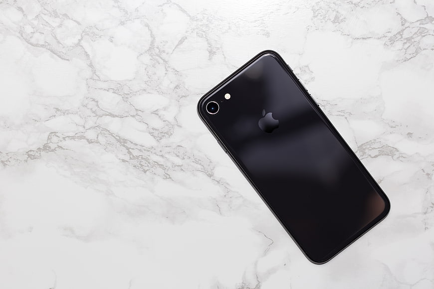Black Smartphone on White Marble Background