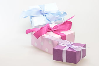 Pastel Gift Boxes with Ribbons on White Background