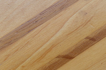 Close-up of natural wood grain texture with diagonal lines