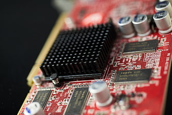 Close-up of red computer graphics card circuit board