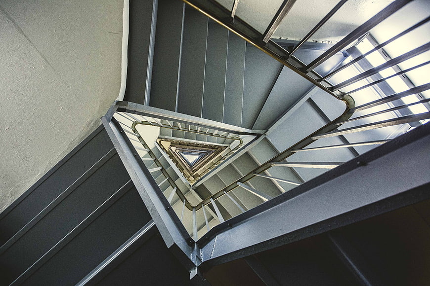 Abstract view of modern triangular spiral staircase