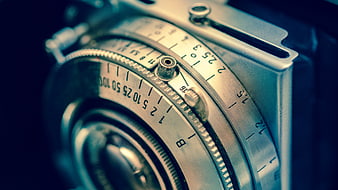 Close-up of vintage camera lens aperture and shutter speed dials