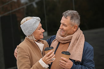 Happy Senior Couple Drinking Coffee Outdoors