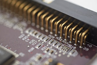 Macro shot of electronic circuit board components and pins