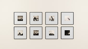 Minimalist gallery wall with black and white mountain prints
