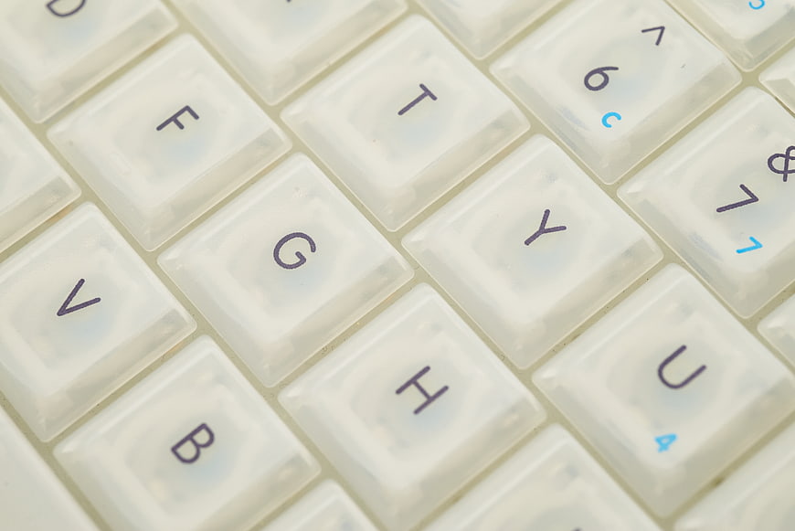 Close-up of white computer keyboard keys with shallow depth of field