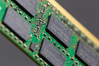Macro shot of green RAM module circuit board