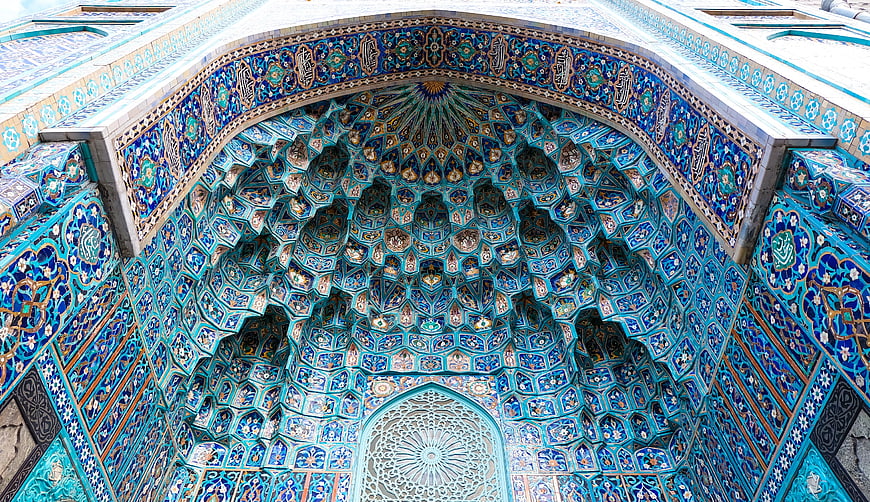 Intricate Blue Muqarnas Archway with Persian Tilework