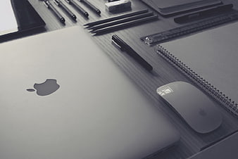 Minimalist Workspace with Laptop, Mouse, and Stationery