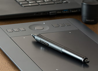 Wacom Graphics Tablet and Stylus Pen on Desk