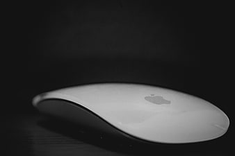 Minimalist Apple Magic Mouse on Dark Background