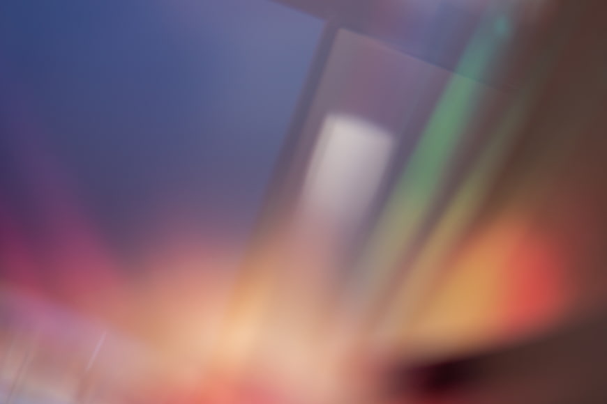 Abstract Blurred Background with Colorful Light Leaks and Soft Gradients