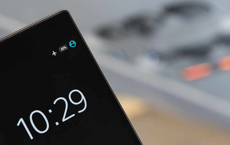 Smartphone Screen Showing Flight Mode Icon and Time