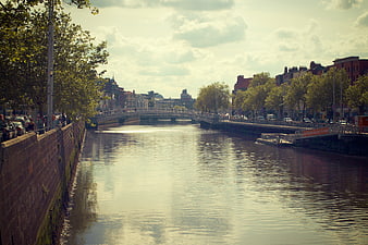 River Liffey Dublin Ireland with Ha'penny Bridge and Cityscape