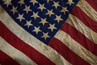 Close-up of vintage weathered American flag fabric texture