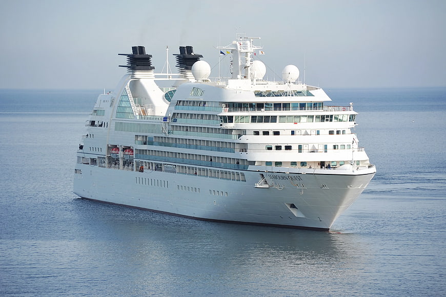 White Seabourn Quest Cruise Ship Sailing on Calm Blue Ocean