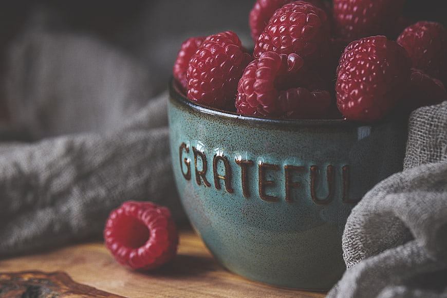 Rustic Bowl of Raspberries with Grateful Typography