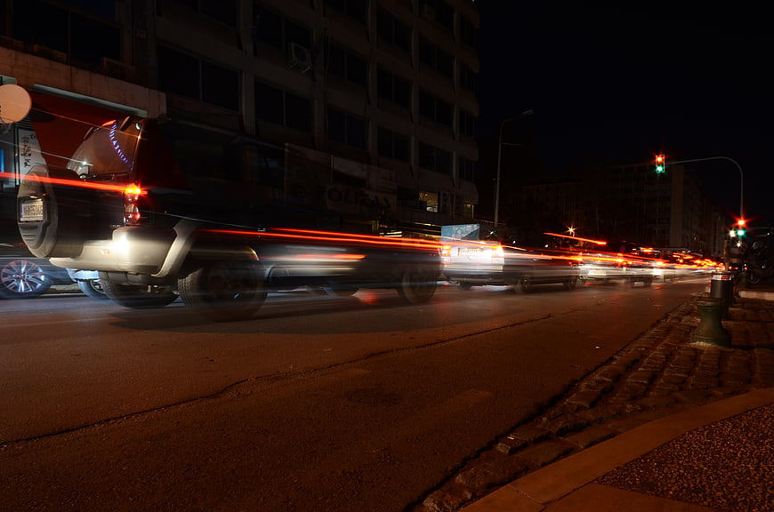 Night traffic light trails on urban city street