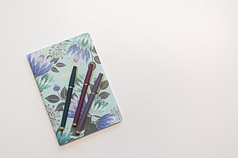 Floral Notebook and Pens Flat Lay on White Background