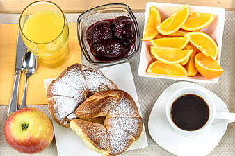 Top view of healthy breakfast with croissants, coffee, and fruit