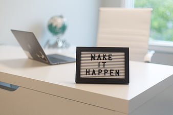 Make It Happen Lightbox Sign on Modern Office Desk