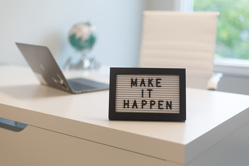 Make It Happen Lightbox Sign on Modern Office Desk