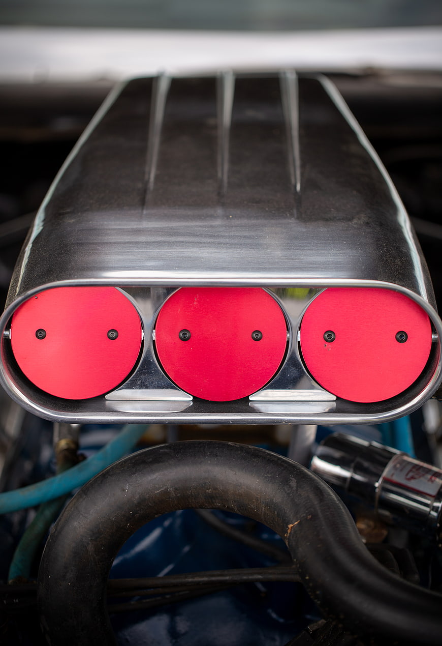 Close-up of vintage muscle car engine air intake