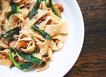 Pappardelle Pasta with Mushrooms and Sage on White Plate