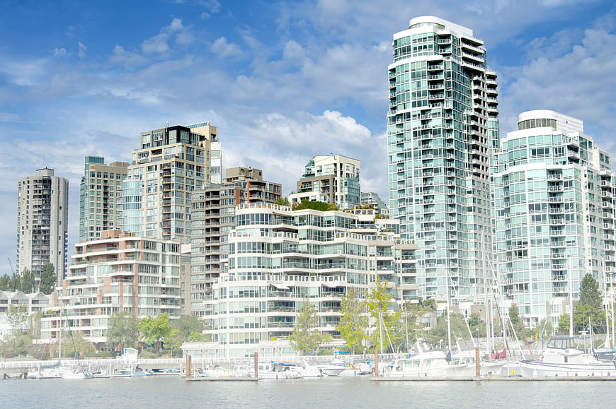 Modern High-Rise Cityscape with Marina and Boats