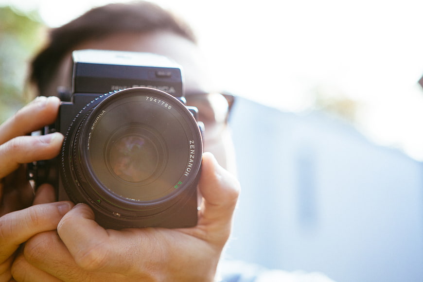 Close-up of Photographer Holding Vintage Bronica Camera