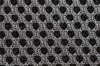 Close-up of textured gray and black woven mesh fabric pattern