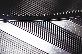 Abstract Macro Shot of Textured Metal Grating and Silver Surfaces