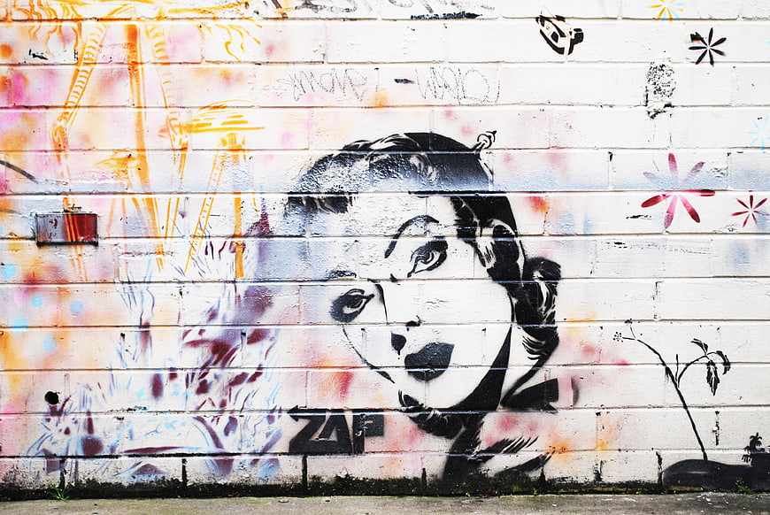 Vintage Audrey Hepburn Graffiti on Urban Brick Wall
