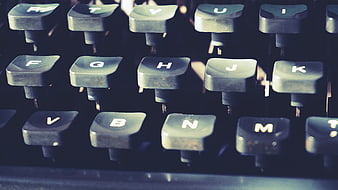 Close-up of vintage typewriter keys with shallow depth of field