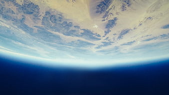 Earth Horizon from Space with Desert and Clouds