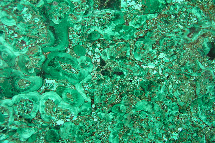 Close-up texture of polished green malachite mineral stone