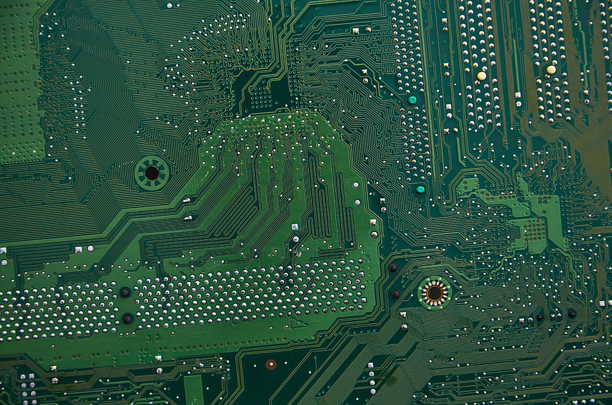 Close-up of green circuit board with electronic components