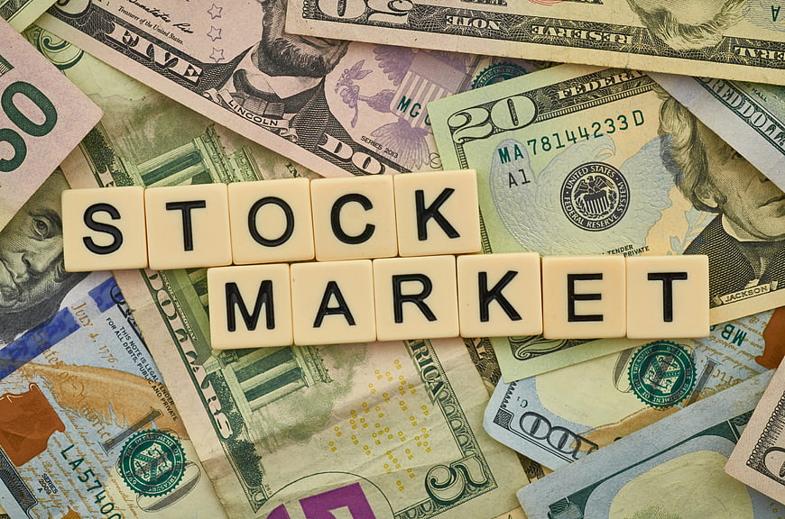 Stock Market Scrabble Tiles on US Dollar Bills