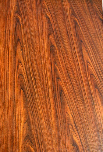 Close-up of rich brown wood grain texture pattern