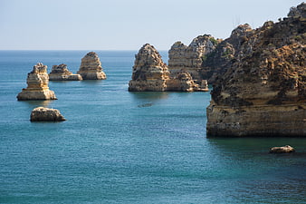 Praia do Camilo coastal cliffs and rock formations in Portugal