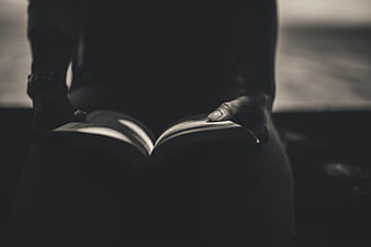 Woman Reading Open Book in Black and White